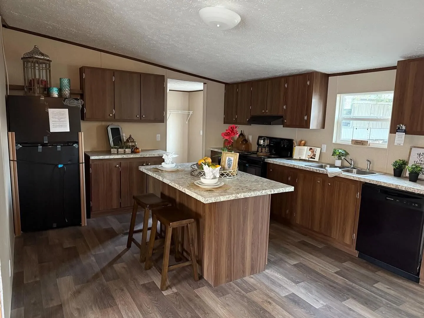 Kitchen with wood cabinets and island seating
